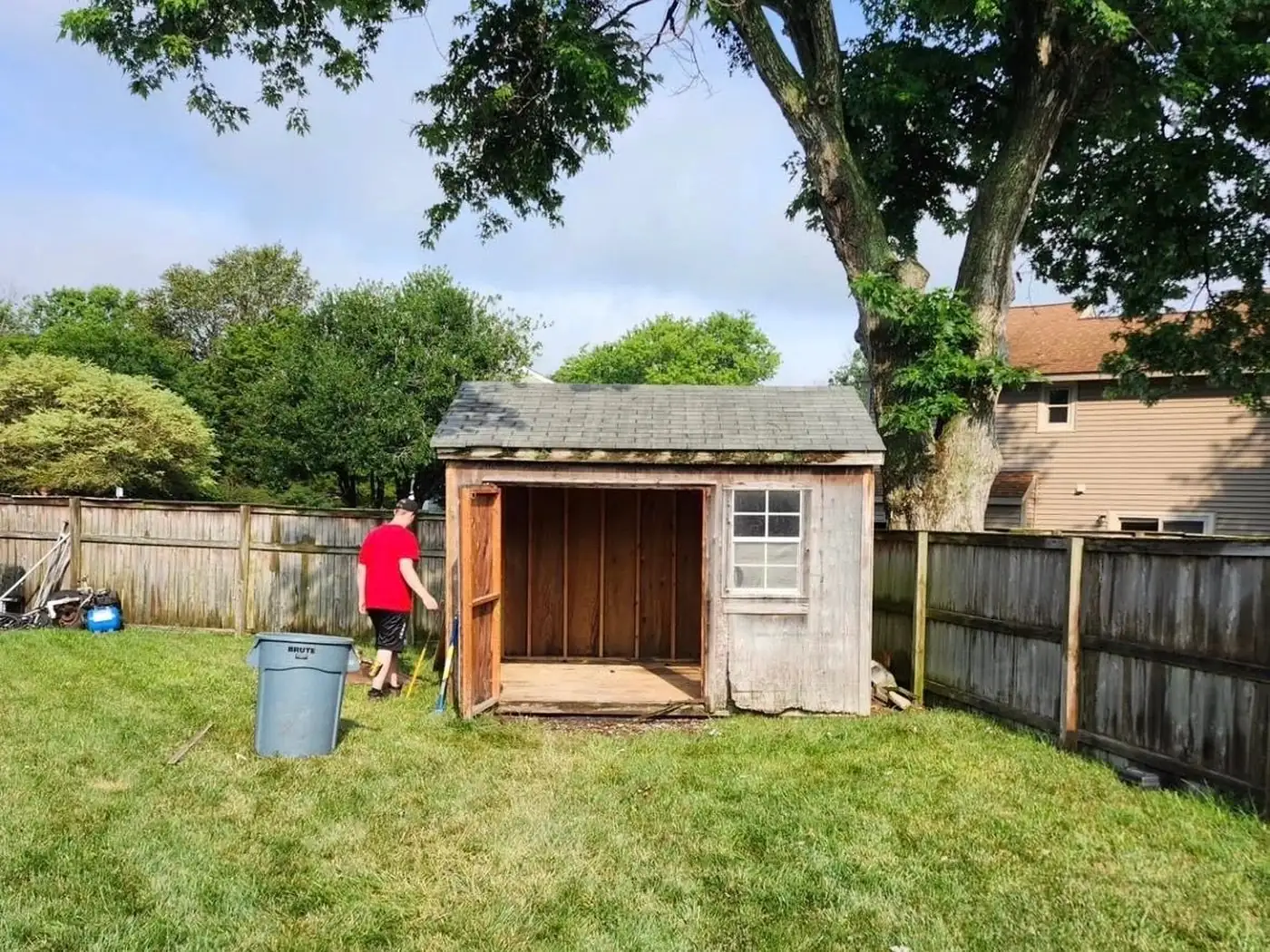 A backyard shed being cleared out and emptied during a 2 Florida Boys cleanout
